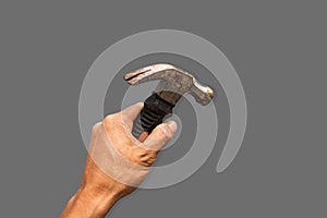 Top angle of a young man holding hammer