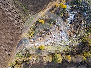 Top areal view from drone above trash and garbage dump.