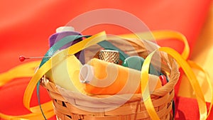 Top of basket with colorful threads, buttons