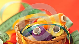 Top of basket with colorful threads, measuring