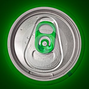 Top of beer can on a green background