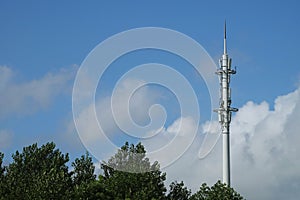 Top of the cellular antenna installed in the green garden