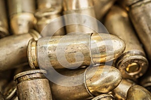 Top close-up macro view of large group of gun bullets