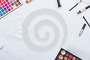 Top closeup of make-up products on the white background