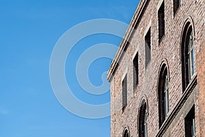 Top corner of brick building.