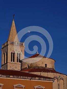 Top of Crkva sv. Donata church on blue sky background with white moon in  Zadar, Croatia