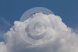 Top of cloud against blue sky