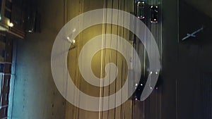 Top down aerial drone view of a road at night with cars driving, clip. Traffic on highway toward modern city. Headlights