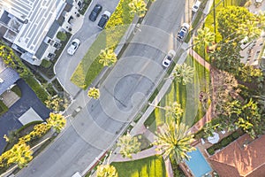 Top down aerial view of Beverly Hills neighborhood, Beverly Hills Hotel, and Sunset Boulevard surrounded with palm trees