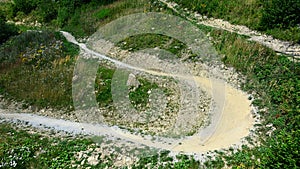 Top down aerial view of curvy downhill mountain bike trail