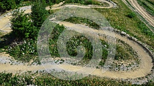 Top down aerial view of curvy downhill mountain bike trail