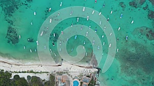 Top down aerial view with moored boats at the coastline of Caribbean Sea at Playa del Carmen, Mexico
