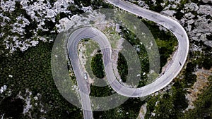 A top-down aerial view on mountainous curvy road Nus de Se Calobra