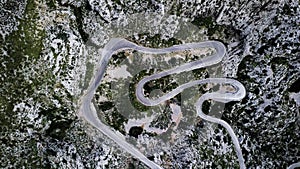 A top-down aerial view on mountainous curvy road Nus de Se Calobra