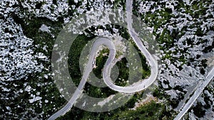 A top-down aerial view on mountainous curvy road Nus de Se Calobra