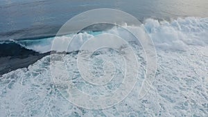 Top down aerial view of the ocean giant waves, foaming and splashing Slow-motion