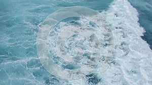 Top down aerial view of the ocean giant waves, foaming and splashing slow-motion