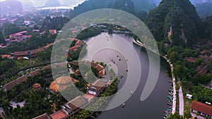 Top down aerial view of rowing boats taking tourists around sights of Ninh Binh