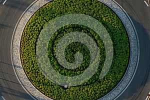 Top down aerial view of a small traffic roundabout