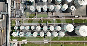 Top down aerial view on state of the art stainless steel storage tanks.