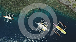 Top down of boats at green mount ocean coast aerial view. Epic summer landscape with vessels