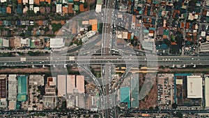 Top down cars drive at cross freeway in aerial view. Highway traffic transportation at Manila city photo