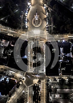 Top down city grid at night. Monument of freedom in Latvia photo
