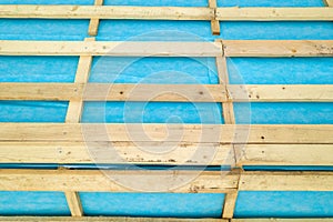 Top down detail of a wooden roof frame on a house under construction