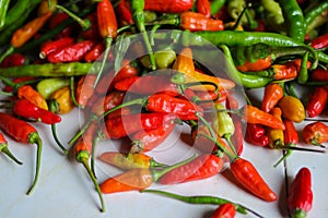 Flat lay view of a bunch of fresh datil peppers or cabai rawit harvested by Indonesian Local Farmers from the garden photo