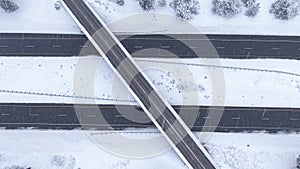 TOP DOWN: Flying over a highway overpass in the middle of an intense blizzard.