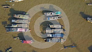 TOP DOWN: Flying over the wooden boats forming the famous floating market.