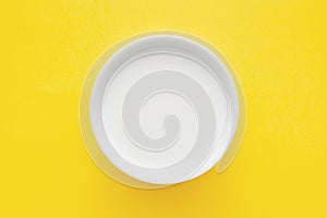 Top down minimalist view of a milk in a white bowl