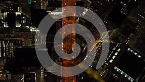 Top down shot of illuminated streets and high rise business buildings in Financial District at night. San Francisco