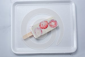 top down strawberries and cream paleta photo
