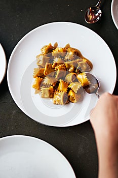 Top Down View of Agnolotti Served on a Round Plate
