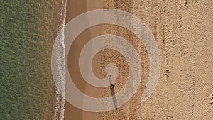 Top down view of beautiful sandy beach. Coastline with turquiose sea waves.