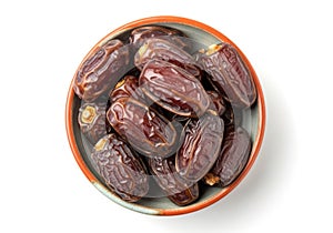 Bowl of medjool dates isolated on white background