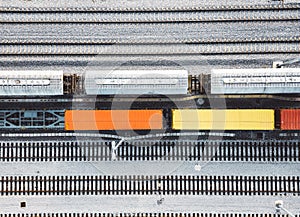 Top down view colorful wagons standing still parked on the railway lines