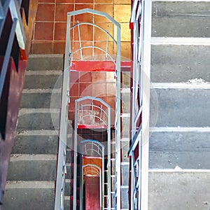 Top-Down View of Concrete Stairs, Metal Handrails in High-Rise Residential Building. Emergency Exit Concept