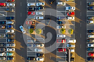 Top down view from drone on mall parking with many cars