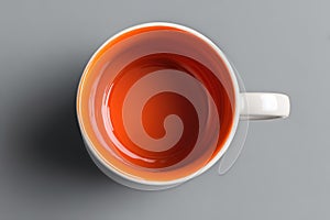 Top Down View of Empty Orange and White Coffee Mug