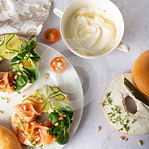 Top down view of everything bagels topped with cream cheese, smoked salmon lox