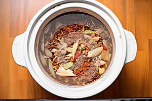 top-down view of fermentation crock with chili mix