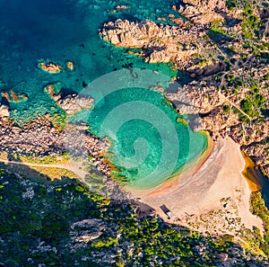 Top down view of Li Cossi beach. Splendid summer scene of Costa Paradiso, Sardinia island, Italy, Europe. Attractive Mediterranean