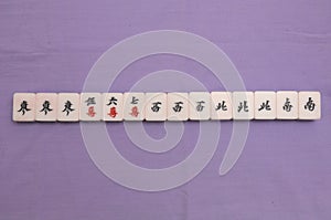 Top down view of the Little Winds winning hand in a Mah Jong game set
