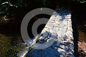 Top down view of old stone barrier dam on Sutov Creek in Mala Fatra