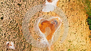 Top down view orange heart shape form on mud volcanoes site in chachuna nature reserve, VAshlovani national park