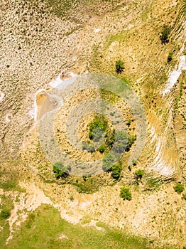 Top down view orange heart shape form on mud volcanoes site in chachuna nature reserve, VAshlovani national park, Georgia
