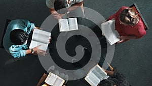 Top down view of prayer reading at bible book and sitting in circle. Symposium.