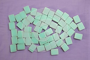 Top down view of the reverse down side of a set of green turquoise Mah Jong game tiles